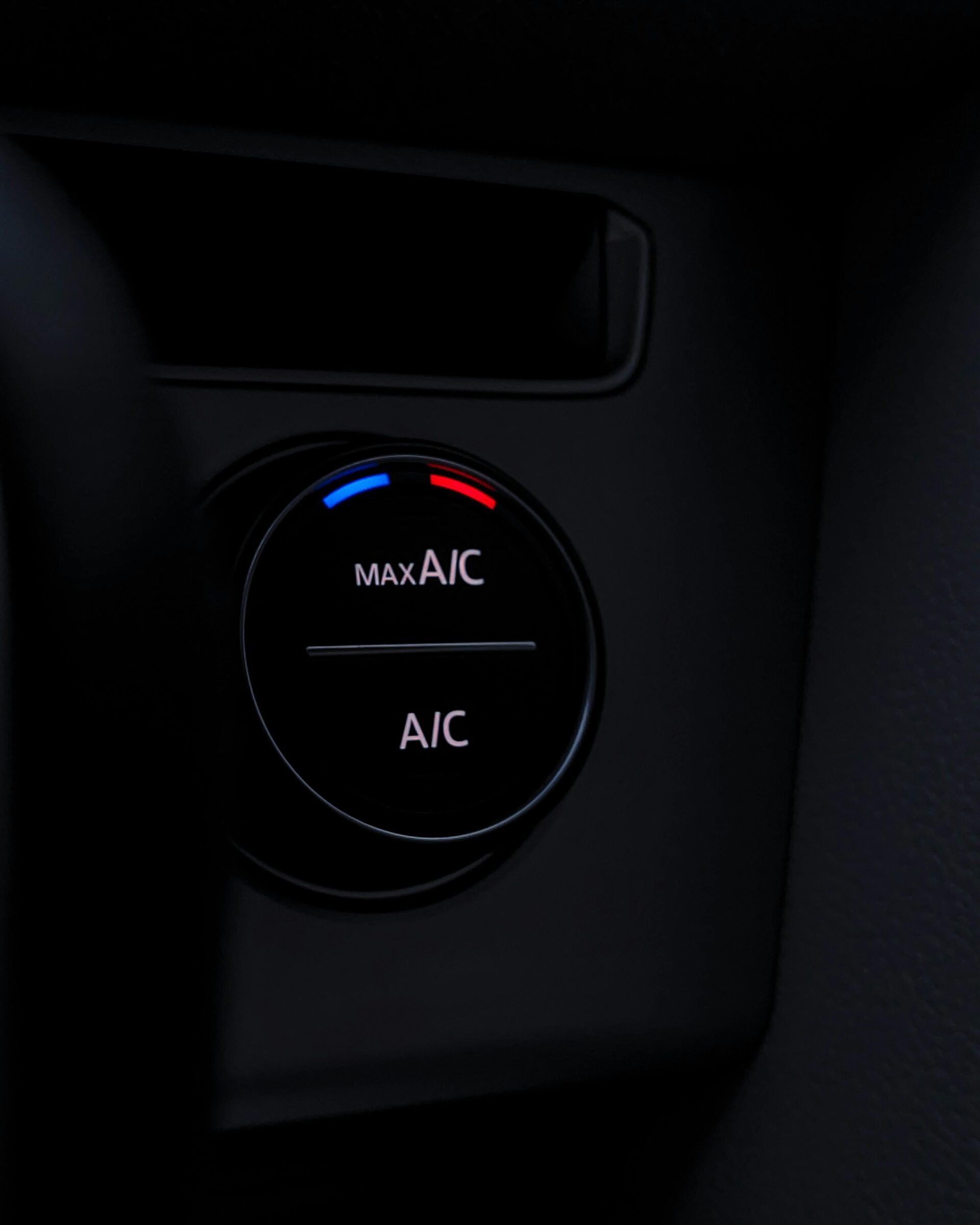 Detailed view of a car air conditioning control knob, highlighting its modern design and functionality.