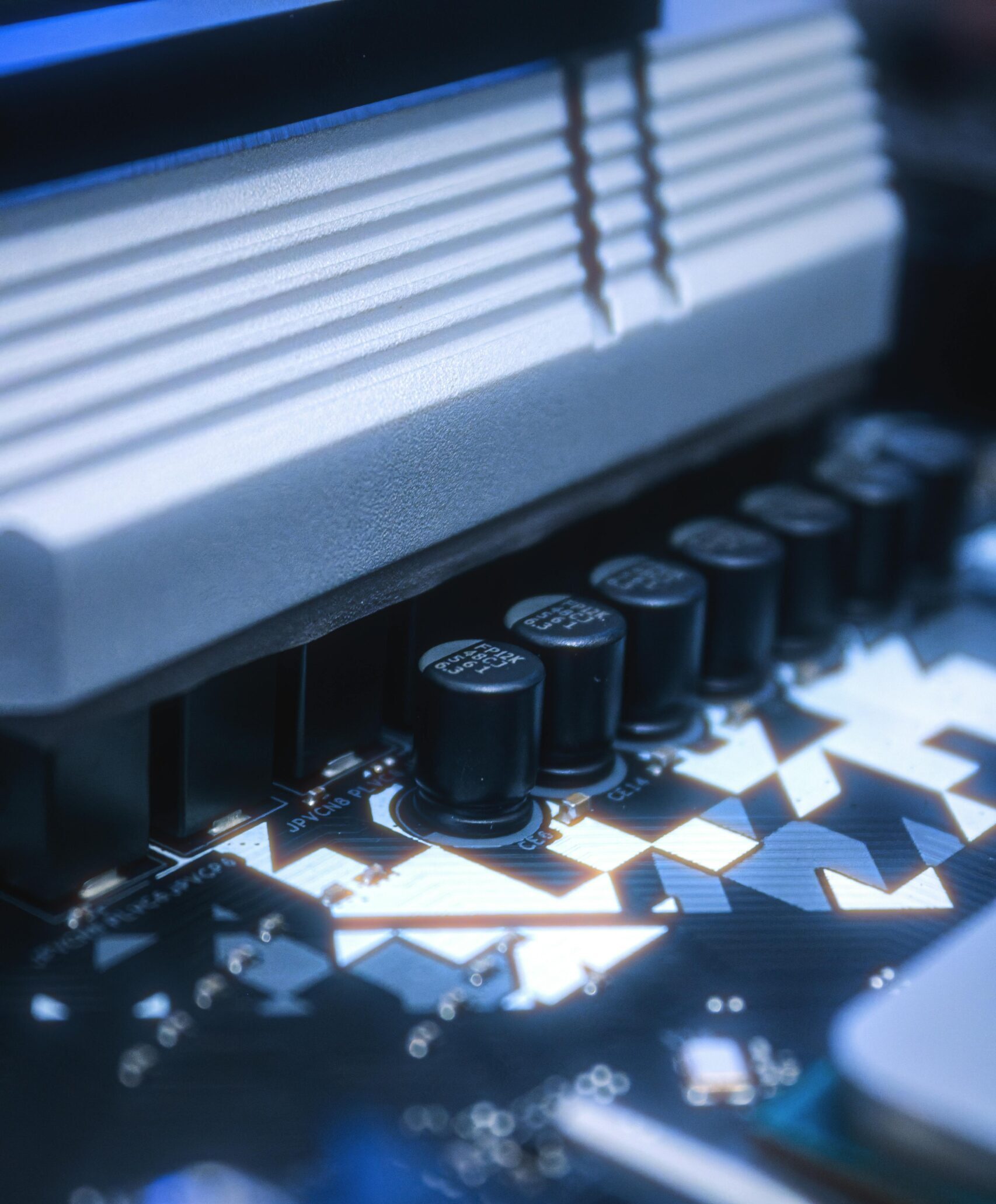 Detailed image of a circuit board featuring capacitors and intricate pathways, ideal for tech-related content.